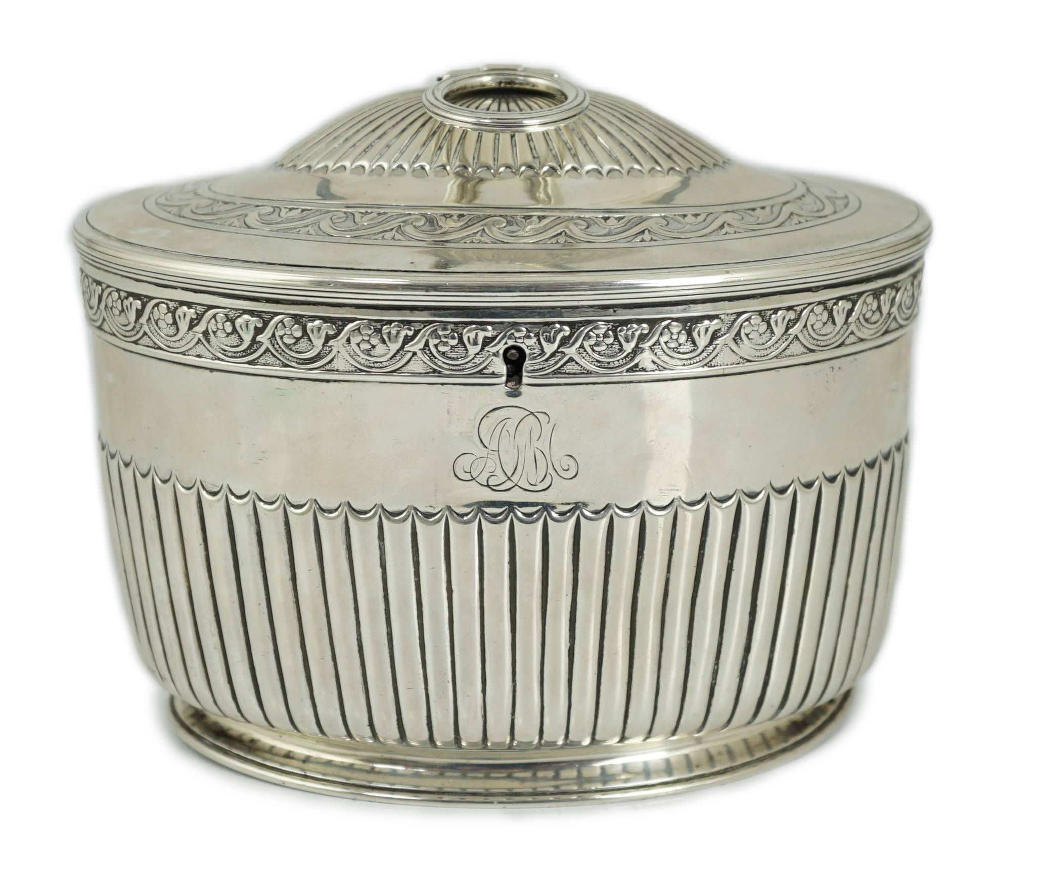 A George III demi fluted silver oval tea caddy by Andrew Fogelberg & Stephen Gilbert